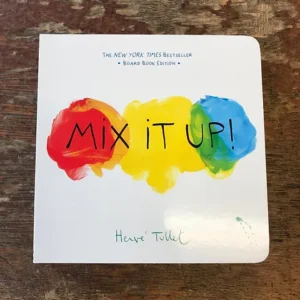 Book cover of ‘Mix It Up!’ by Hervé Tullet, showcasing a splash of colourful paint blobs on a white background with playful, handwritten-style text.