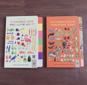 Covers of two children’s activity books. The first, ‘Technicolour Treasure Hunt,’ features vibrant colours and abstract shapes, encouraging kids to explore colour recognition. The second, ‘Pattern-tastic Treasure Hunt,’ showcases bold patterns and designs, inviting children to search for and identify different patterns. Both books are designed to engage young minds in creative learning through visual exploration.