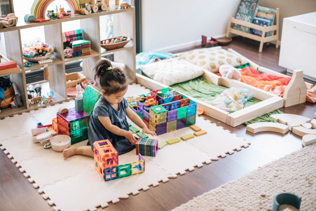 A child playing magnetic tiles