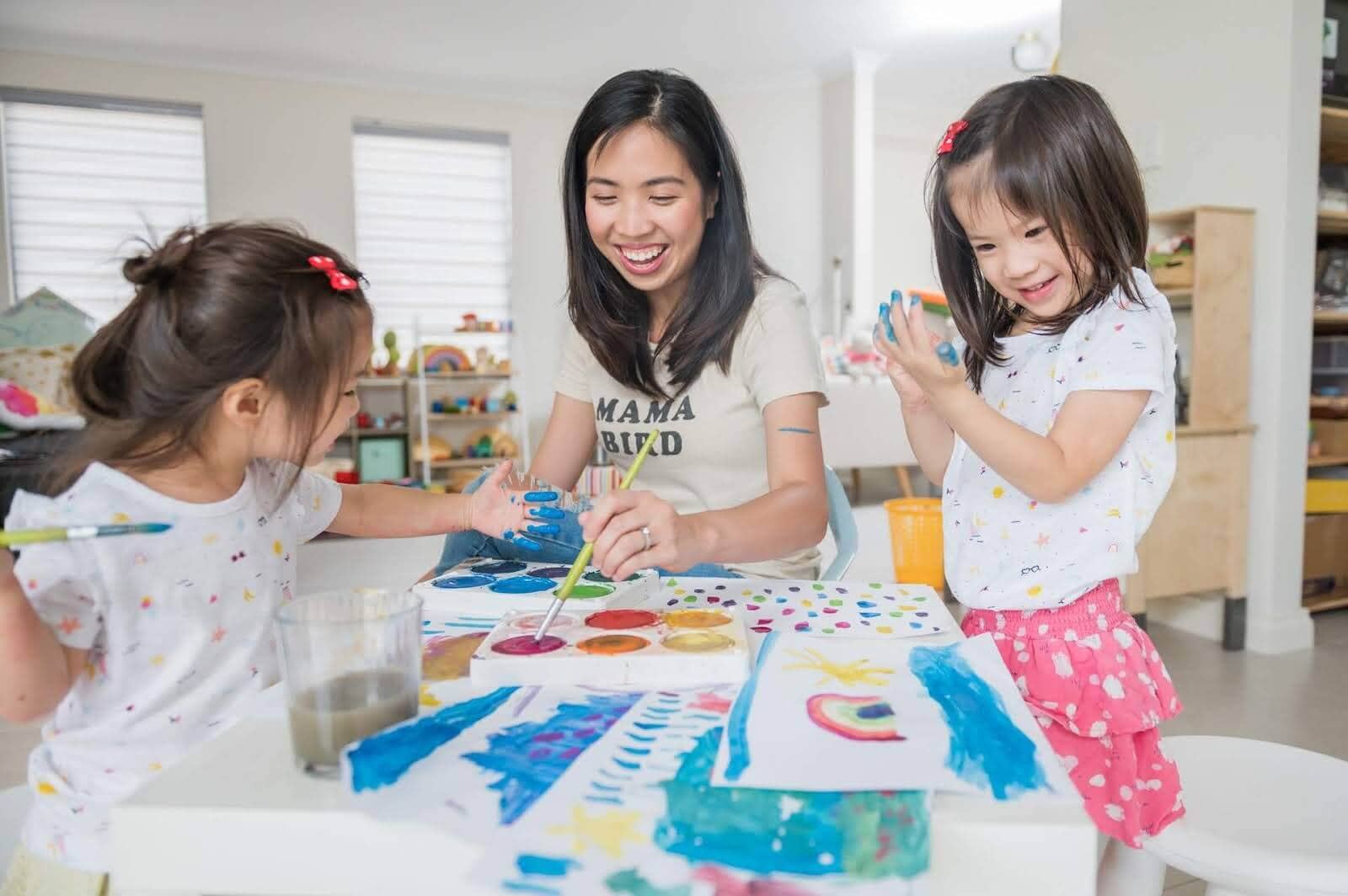 Mom and daughters doing process art at home