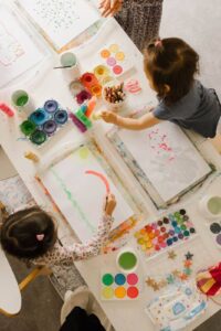 Two toddlers enjoying process art at home