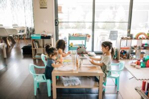 Three children enjoying art activity at home